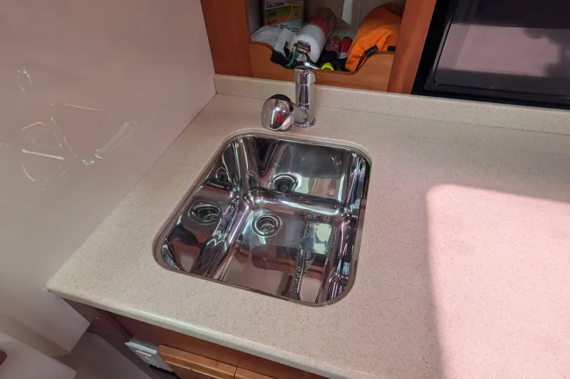 Slide: The Image of Stainless steel sink in 2008 Back Cove 29 boat kitchen area. - 30