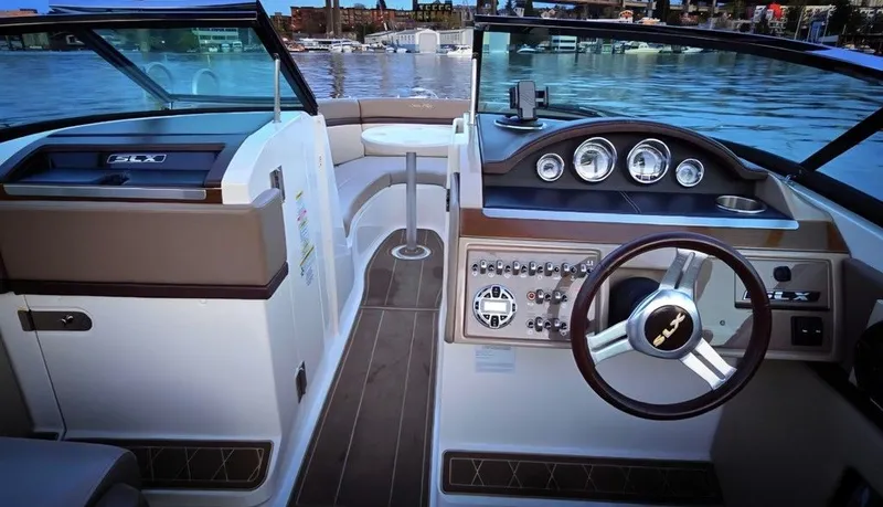 Slide: The Image of The image shows the cockpit of a 2012 Sea Ray SLX 250 with sleek instruments. - 6