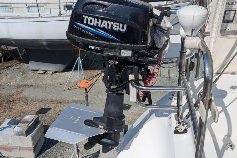Slide: The Image of Catalina 350 sailboat with Tohatsu outboard motor, docked in a boatyard, 2003 model. - 40