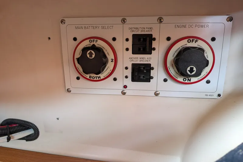 Slide: The Image of Control panel of a 2003 Catalina 350 sailboat with battery and power switches. - 31