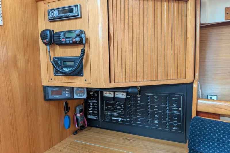 Slide: The Image of Control panel of a 2003 Catalina 350 yacht with communication and navigation equipment. - 28
