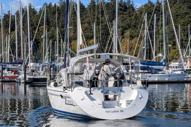 Slide: The Image of Sailboat Catalina 350 (2003) docked at marina, Port Ludlow, WA, surrounded by trees and other boats. - 3
