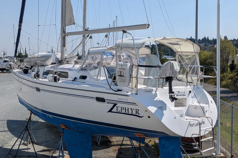 Slide: The Image of Catalina 350 sailboat from 2003 named Zephyr, docked on land for maintenance. - 43