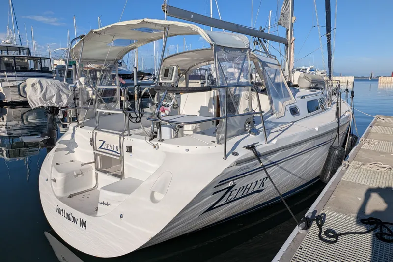 Slide: The Image of 2003 Catalina 350 sailboat docked at marina, named "Zephyr," in Port Ludlow, WA. - 5