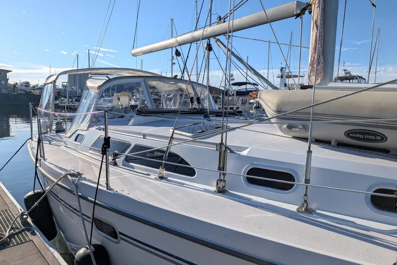 Slide: The Image of Catalina 350 sailboat from 2003 docked at a marina under clear blue skies. - 8