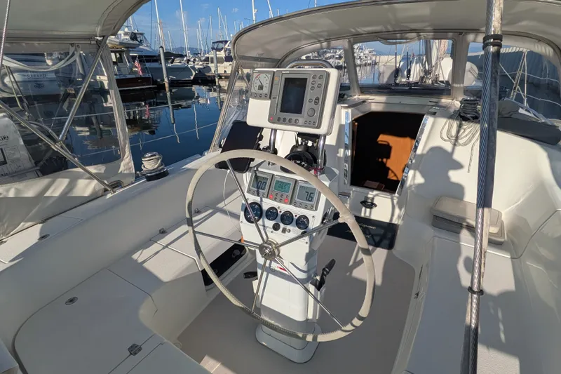 Slide: The Image of Cockpit of 2003 Catalina 350 sailboat with steering wheel and navigation instruments. - 14