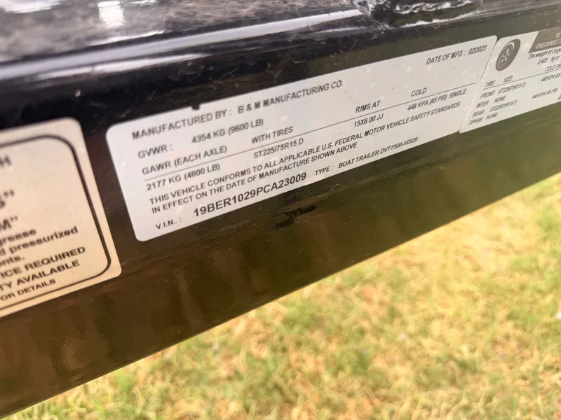 Slide: The Image of Close-up of a boat trailer with manufacturer and specification labels on a metal frame. - 27