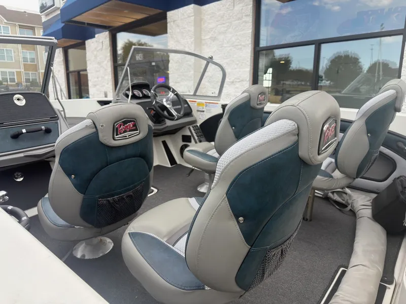 Slide: The Image of The image shows the interior of a 2024 Ranger 1850 MS boat with four cushioned seats. - 15