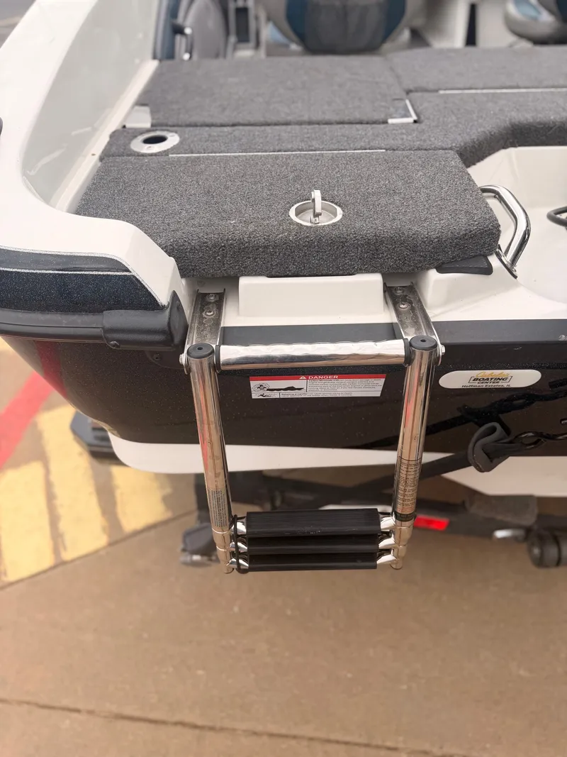 Slide: The Image of A swim ladder is mounted at the stern of a 2024 Ranger 1850 MS boat. - 18