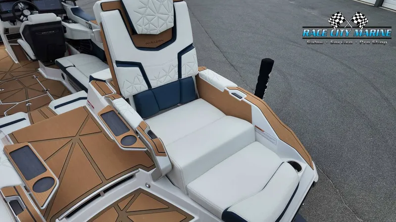 Slide: The Image of The image shows the luxurious interior of a Nautique P23 boat with sleek seating and modern details. - 22