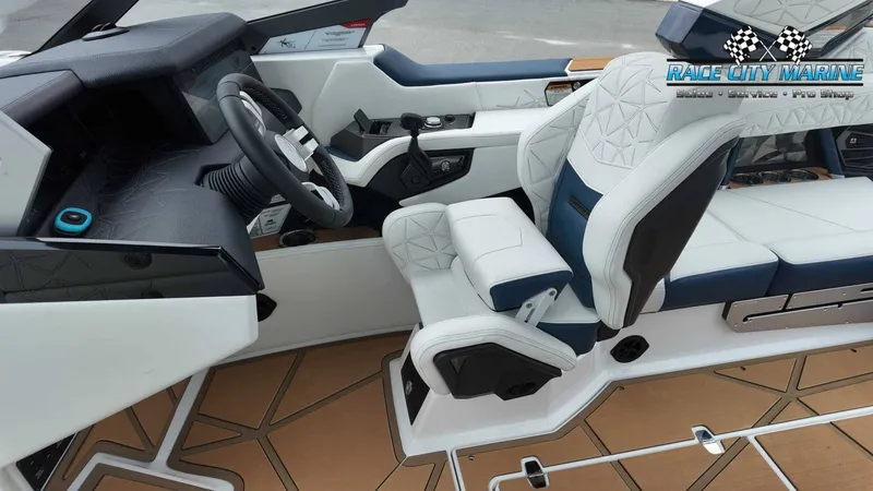 Slide: The Image of The image shows the cockpit of a 2027 Nautique P23 with luxurious white and blue seating. - 45