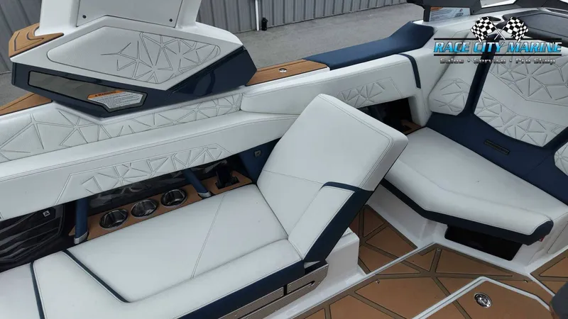 Slide: The Image of The image shows luxurious white and blue seating in a modern boat. - 32