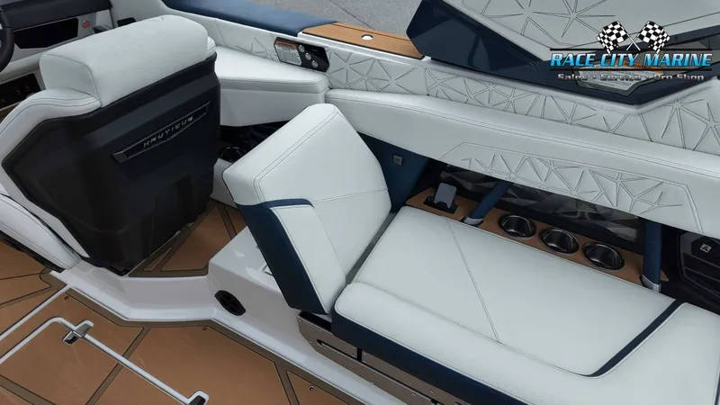 Slide: The Image of Interior of a 2027 Nautique P23 with white and blue upholstery and modern details. - 29
