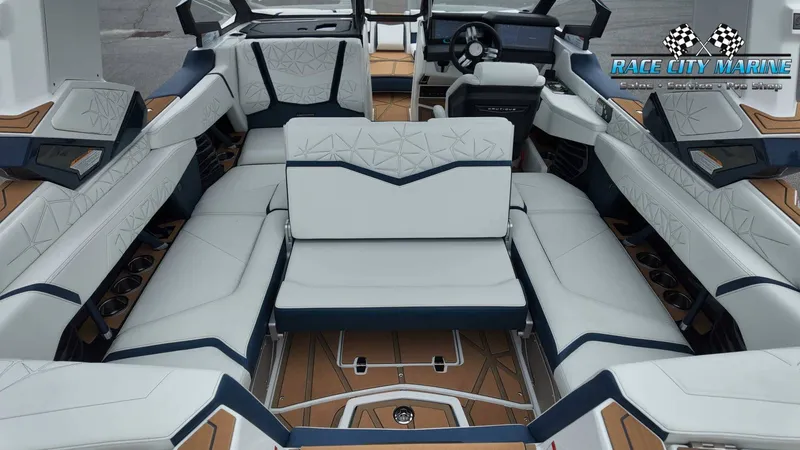 Slide: The Image of The image shows the luxurious interior of a 2027 Nautique P23 with elegant white and blue upholstery. - 27