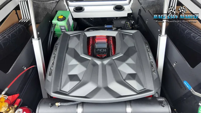 Slide: The Image of The engine compartment of a 2027 Nautique P23 features a powerful PCM engine. - 31