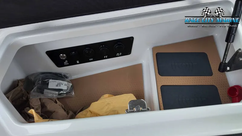 Slide: The Image of A boat storage compartment with switches and accessories. - 44