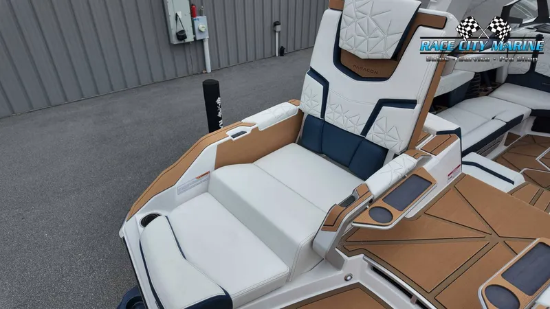 Slide: The Image of The image shows the luxurious interior of a 2027 Nautique P23 boat with elegant seating. - 18