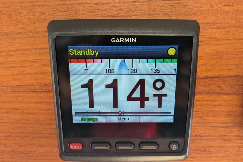 Slide: The Image of Garmin navigation display on 1997 Nordic Tug 32, showing heading of 114 degrees. - 33
