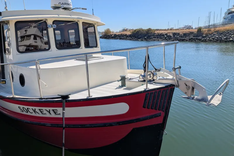 Slide: The Image of 1997 Nordic Tug 32 boat named Sockeye docked in a calm marina. - 5