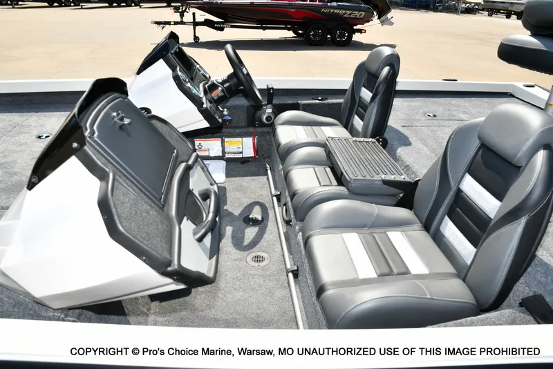 Slide: The Image of The image shows the cockpit of a Ranger RT198P boat with gray and black seats. - 33