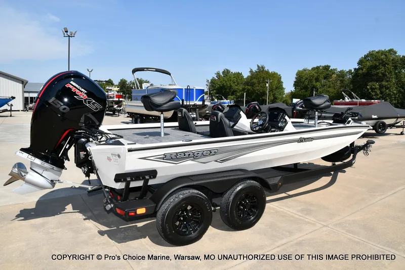 Slide: The Image of A white 2027 Ranger RT198P boat sits on a trailer in a parking lot. - 4