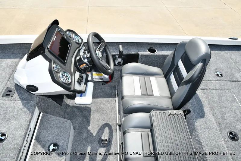 Slide: The Image of The image shows the cockpit of a Ranger RT198P boat with gray seats and a modern helm. - 38