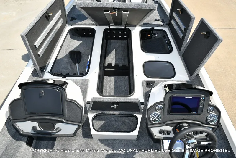 Slide: The Image of The image shows the cockpit of a Ranger RT198P boat with a helm console and storage compartments. - 24