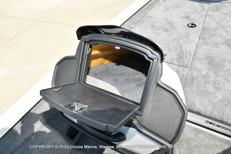 Slide: The Image of An open storage compartment on a 2027 Ranger RT198P boat, featuring gray carpeting. - 42