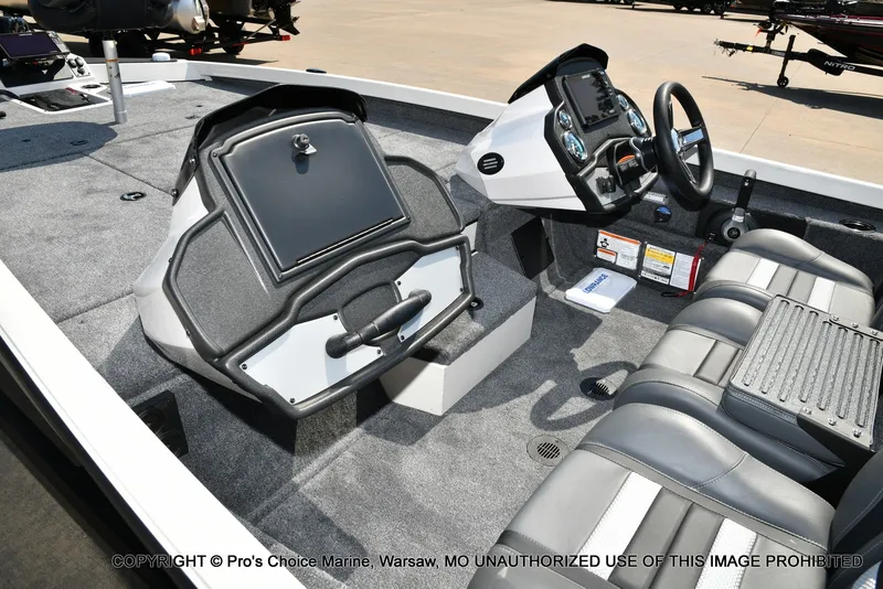 Slide: The Image of The image shows the cockpit of a Ranger RT198P boat with gray seats and a modern helm. - 15
