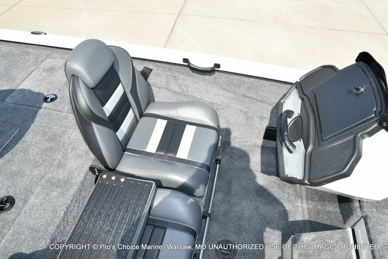 Slide: The Image of The image shows the interior of a Ranger RT198P boat with gray seats and a console. - 40