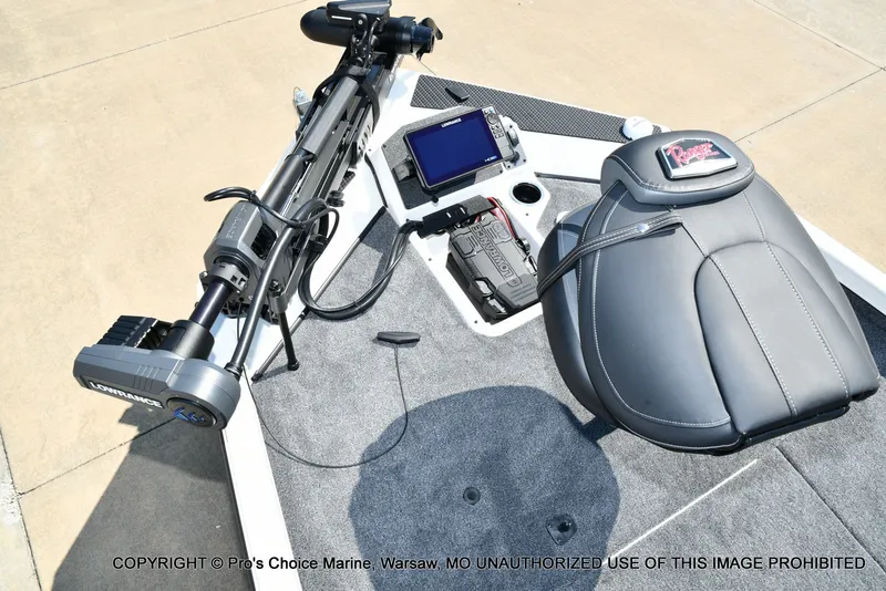 Slide: The Image of The image shows the cockpit of a Ranger RT198P boat with a helm seat and a screen. - 18