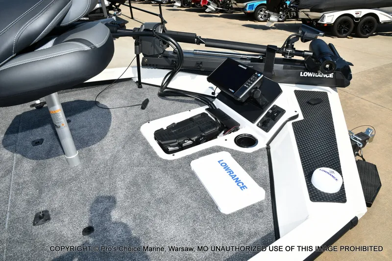 Slide: The Image of The image shows the cockpit of a Ranger RT198P boat with a Lowrance fish finder. - 26