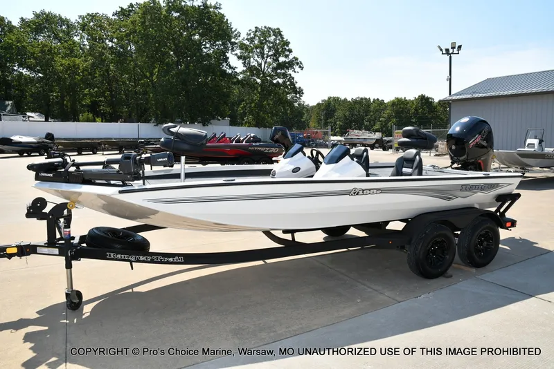 Slide: The Image of A white 2027 Ranger RT198P boat is on a trailer in a parking lot. - 7