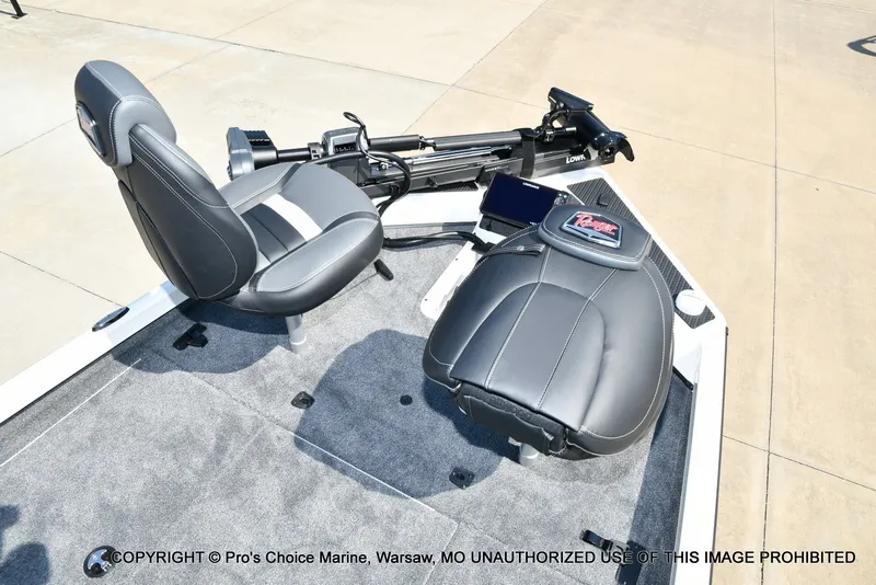 Slide: The Image of The image shows the helm of a Ranger RT198P boat with gray seats and a control unit. - 50