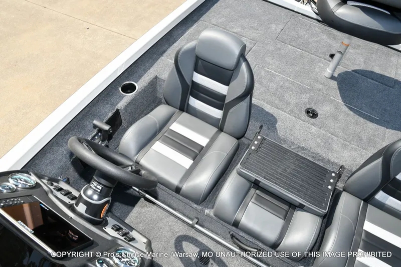 Slide: The Image of The image shows the helm of a Ranger RT198P boat with gray leather seats and a steering wheel. - 46