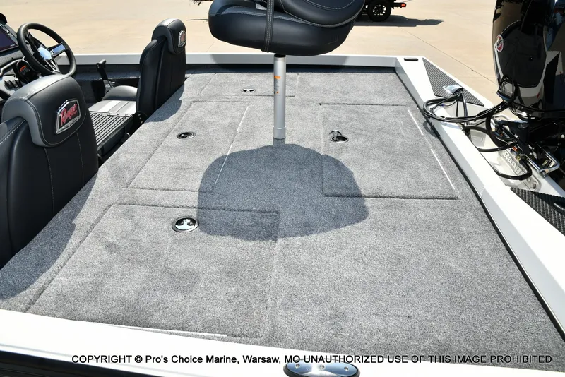 Slide: The Image of The image shows the deck of a Ranger RT198P boat with gray carpeting and black seats. - 31