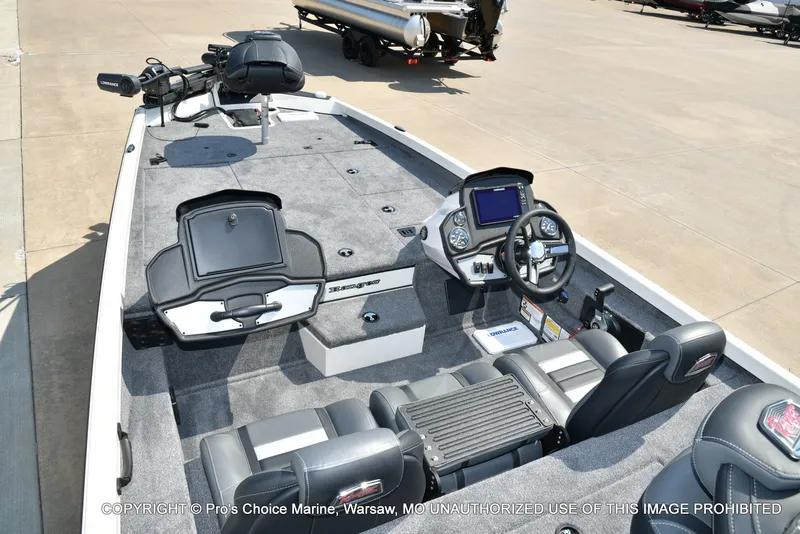 Slide: The Image of The image shows a Ranger RT198P boat with gray carpeting and modern control features. - 34