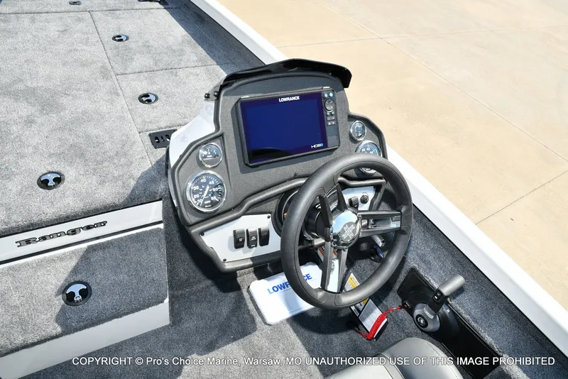 Slide: The Image of The image shows the cockpit of a Ranger RT198P boat with a modern helm and instruments. - 37