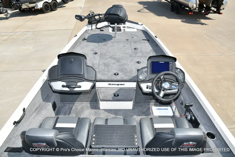 Slide: The Image of The image shows the cockpit of a 2027 Ranger RT198P boat with gray carpeting and modern instruments. - 17