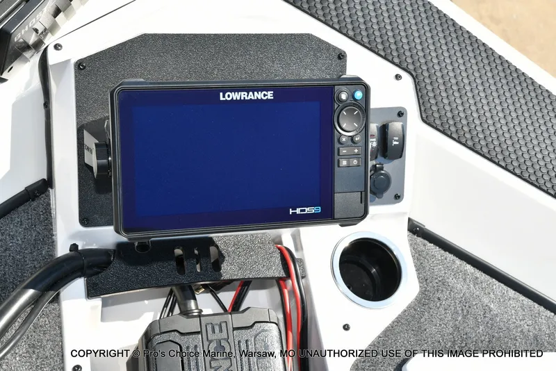 Slide: The Image of A Lowrance fish finder is mounted on a boat, surrounded by gray carpeting. - 44