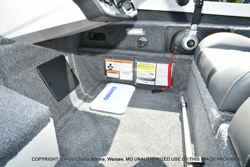 Slide: The Image of Interior view of a Ranger RT198P boat with gray carpeting and a control console. - 39