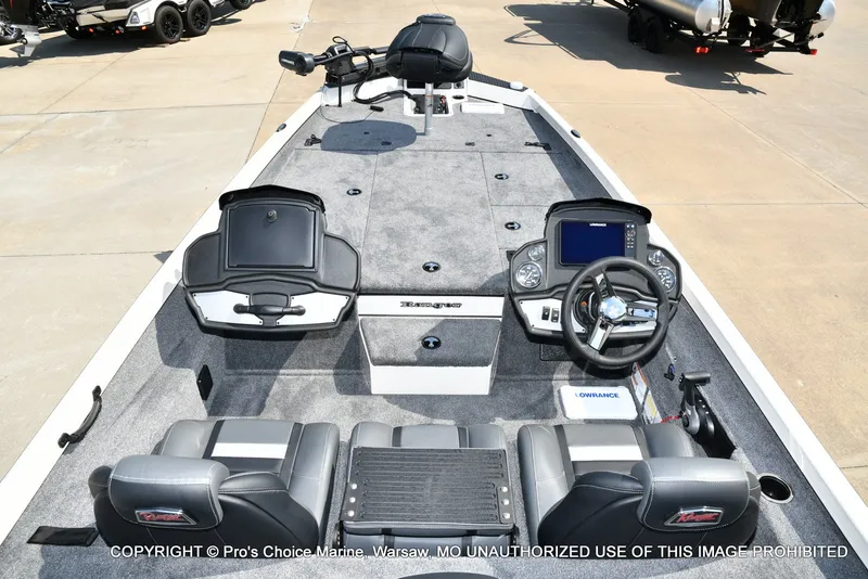 Slide: The Image of The image shows the cockpit of a Ranger RT198P boat with gray carpeting and modern instruments. - 35