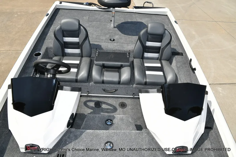 Slide: The Image of The image shows the cockpit of a Ranger RT198P boat with gray and black seats. - 45