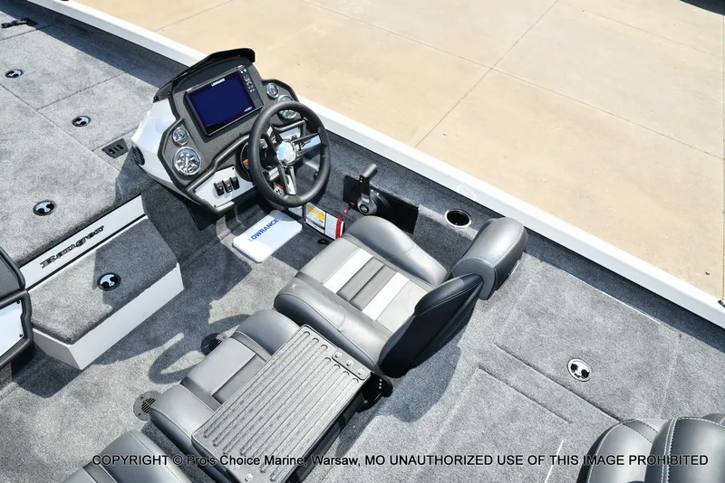 Slide: The Image of The image shows the cockpit of a Ranger RT198P boat with a modern helm and gray seating. - 36