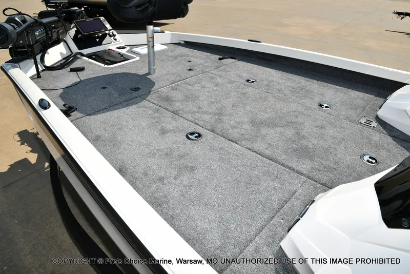 Slide: The Image of The image shows the deck of a Ranger RT198P boat with gray carpeting and fishing equipment. - 32