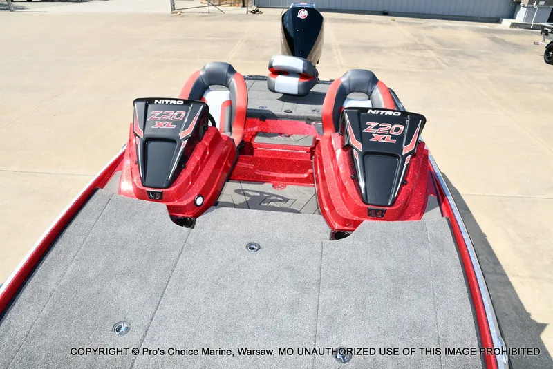 Slide: The Image of The image shows a red Nitro Z20 XL Pro boat with a gray deck and two seats. - 20