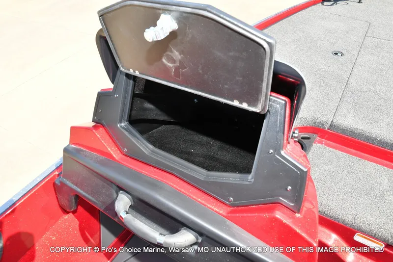Slide: The Image of A red boat with an open storage compartment on the deck. - 35