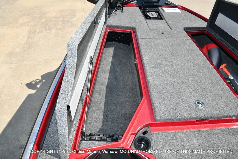 Slide: The Image of The image shows the deck of a Nitro Z20 XL Pro boat with storage compartments. - 47
