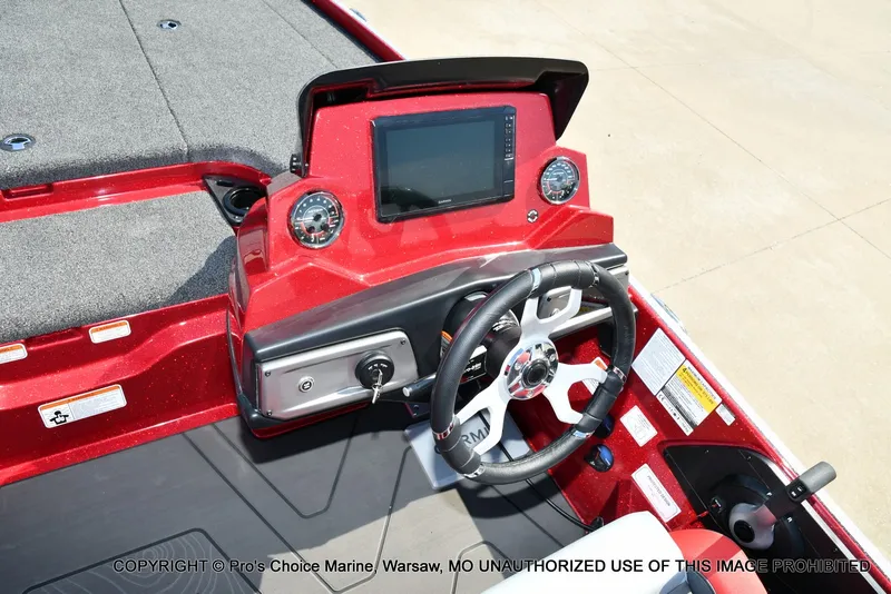 Slide: The Image of The image shows the cockpit of a Nitro Z20 XL Pro boat with a modern helm station. - 30