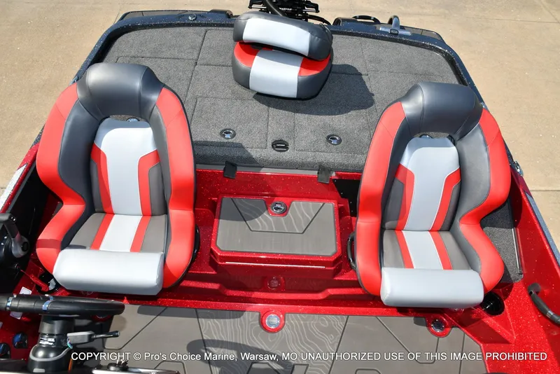 Slide: The Image of The image shows two red and gray seats in a boat with gray carpet flooring. - 21